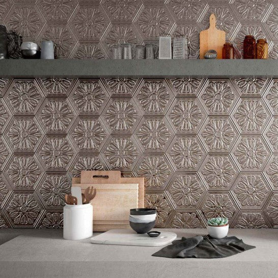 Kitchen backsplash featuring antique copper look porcelain hexagon tiles