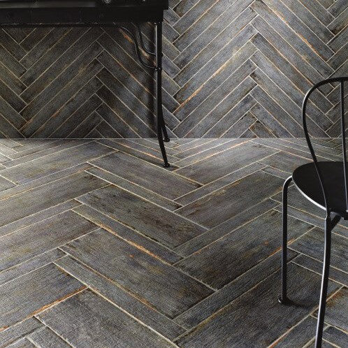 Vintage Look Black Desk & Chair in Room with Gray Distressed Wood Look Tile Wall & Floor