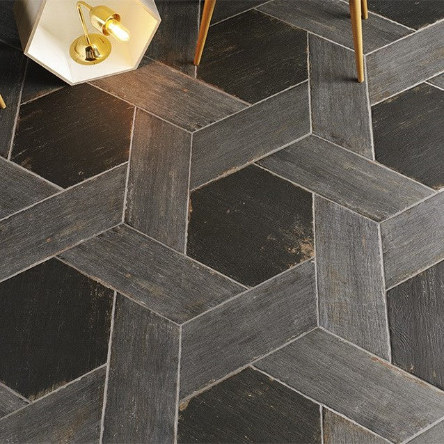 Closeup of Floor Tiled in Black Hexagons Outlined by Gray Wood Look Tile