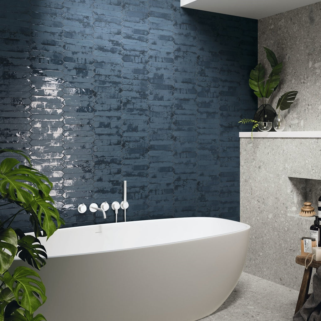 Bathroom with Distressed Blue Ceramic Picket Tile Wall and Freestanding White Tub