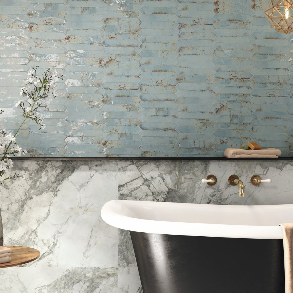 Bathroom with black and white freestanding tub, stone tub surround, and distressed aqua blue ceramic picket tile accent wall