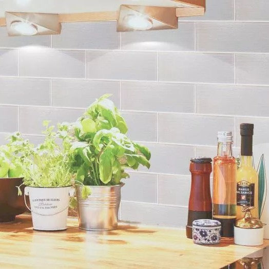 Wooden Kitchen Table with White Glass Subway Tile Backsplash