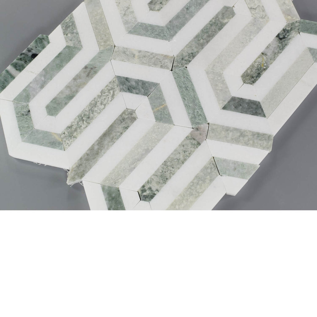 Closeup of Ming Green and White Thassos Marble Greek Key Mosaic Tile on Gray Background